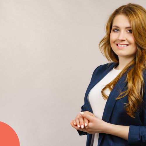 Woman looking at a monitor displaying graphs and data